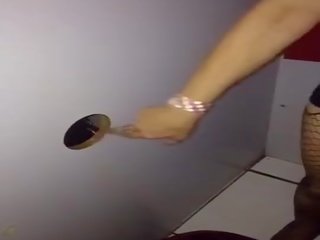 Wife sucks cocks at the gloryhole then leads a group of men cum in theatre